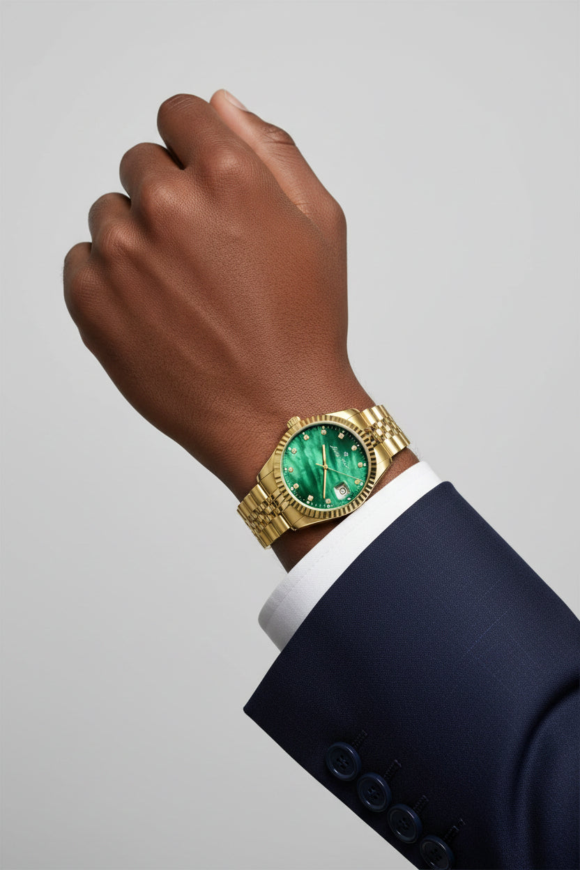A gold-tone watch with a green mother-of-pearl dial and a matching green and gold-tone link bracelet, shown against a plain white background.