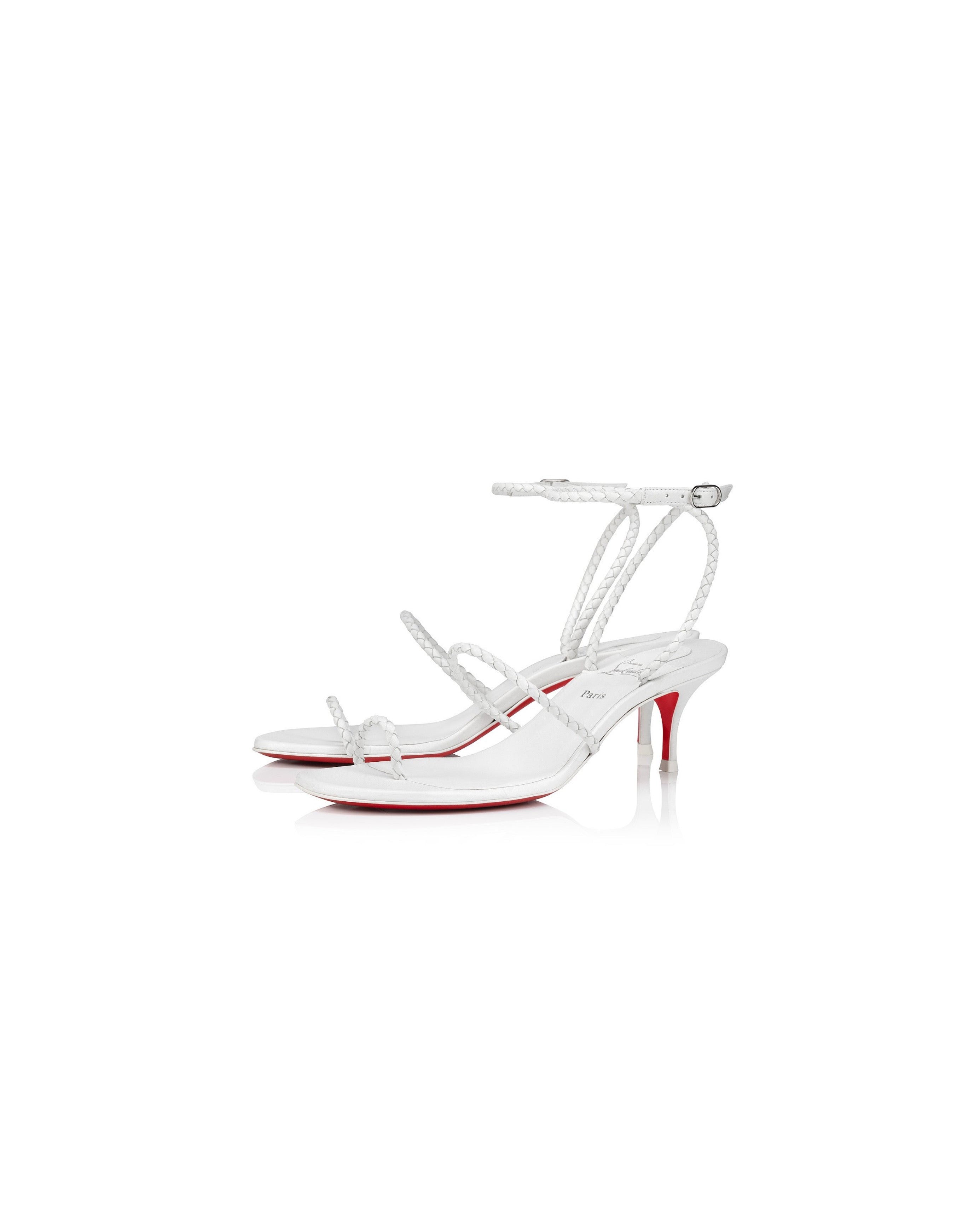 White high-heeled sandals with red soles on a white background